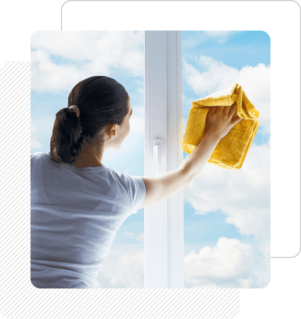 A woman cleaning the outside of a window.